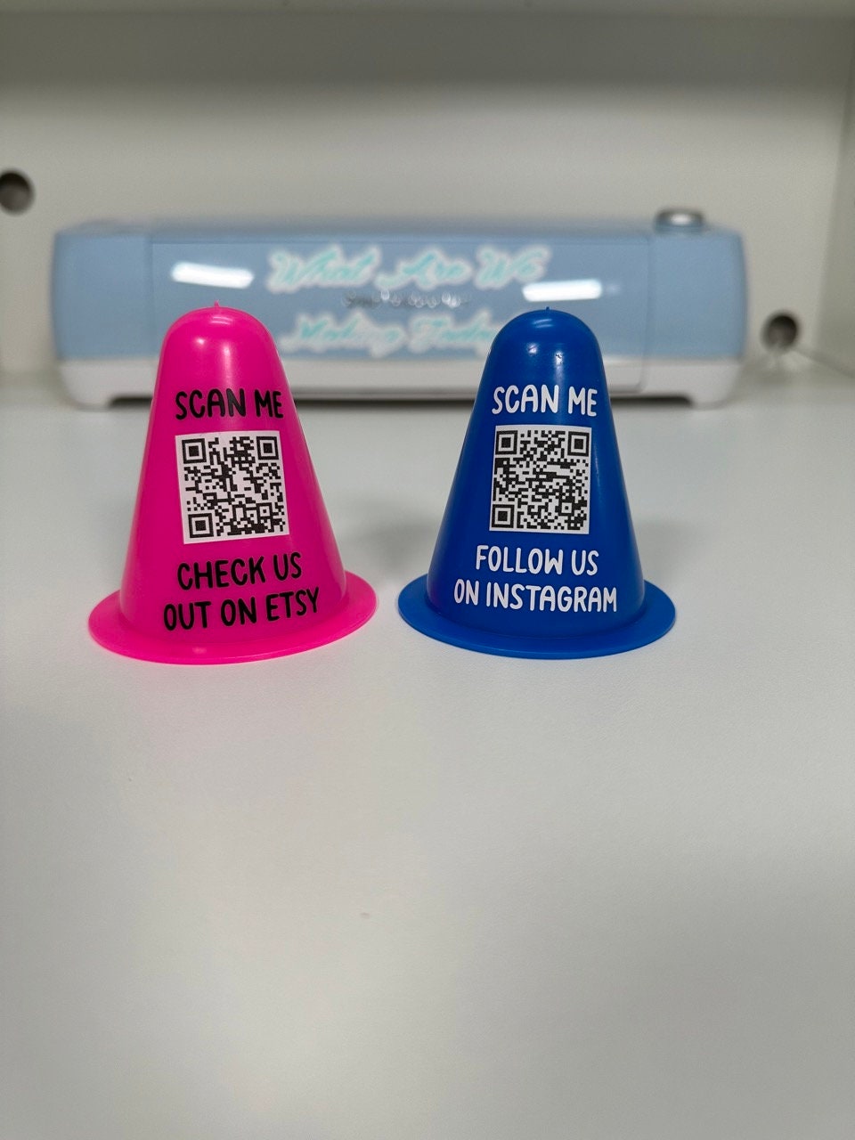 Pink and blue personalized mini traffic cones with custom QR code decals