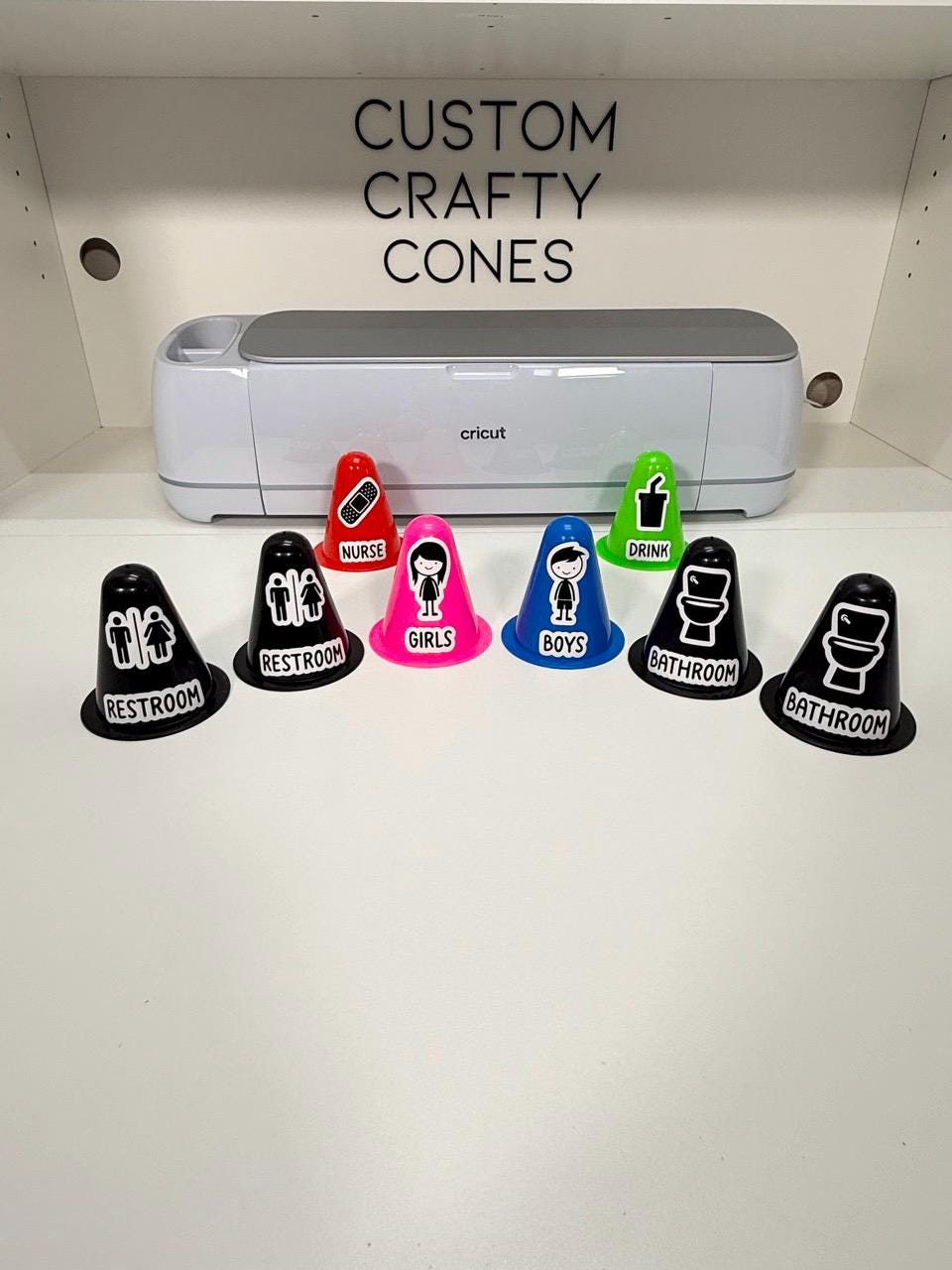 A lineup of custom classroom hall pass cones in bright colors