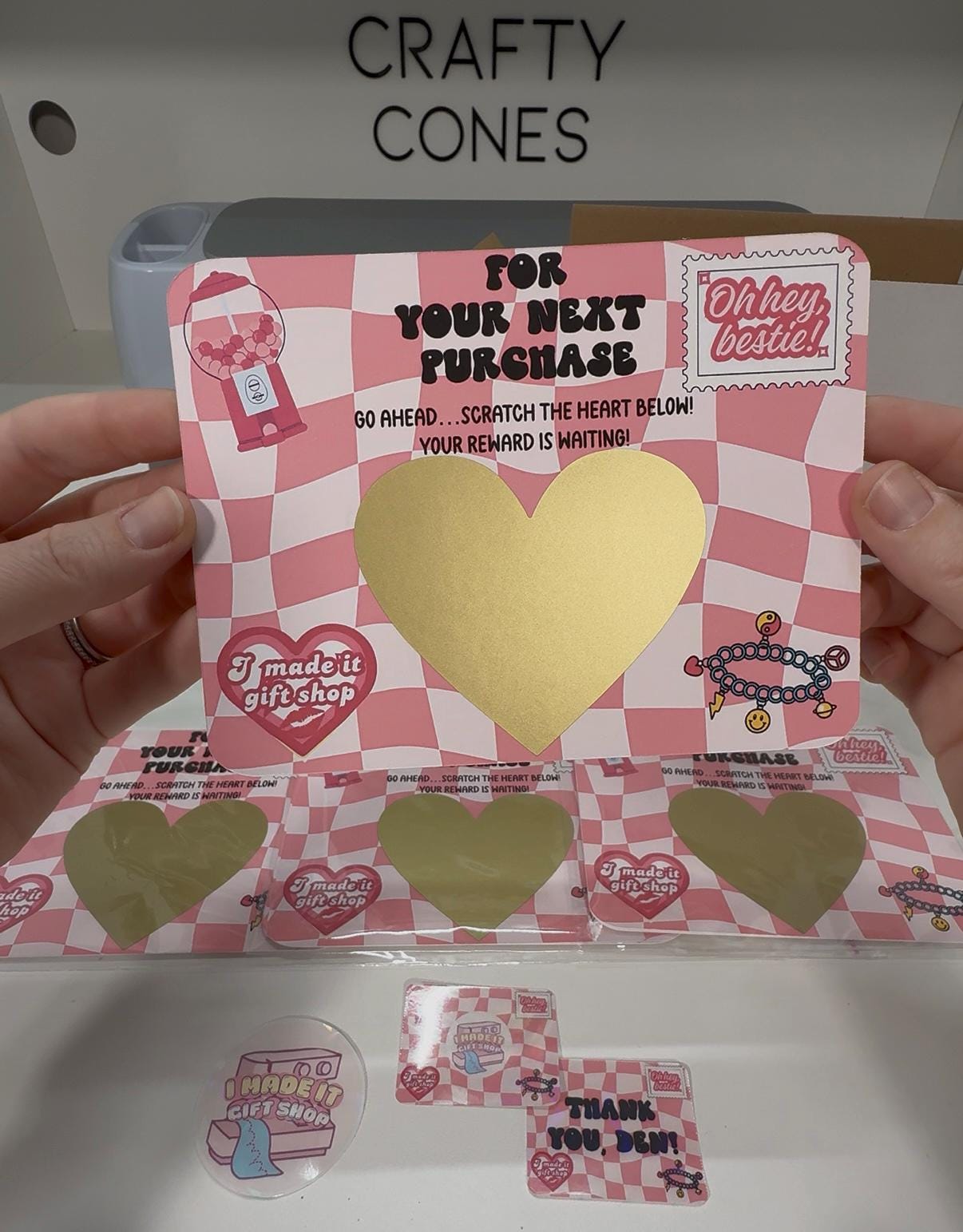 Pink checkered custom scratch-off card with a large gold heart reveal area